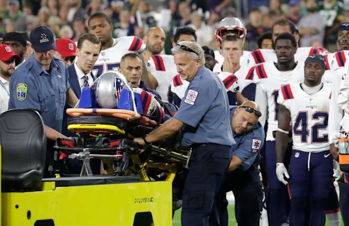 Teammates look on as New England Patriots cornerback Isaiah Bolden (7) is taken off the field on a stretcher after a fourth quarter injury against the Green Bay Packers Saturday, (Dan Powers/USA TODAY Sports)